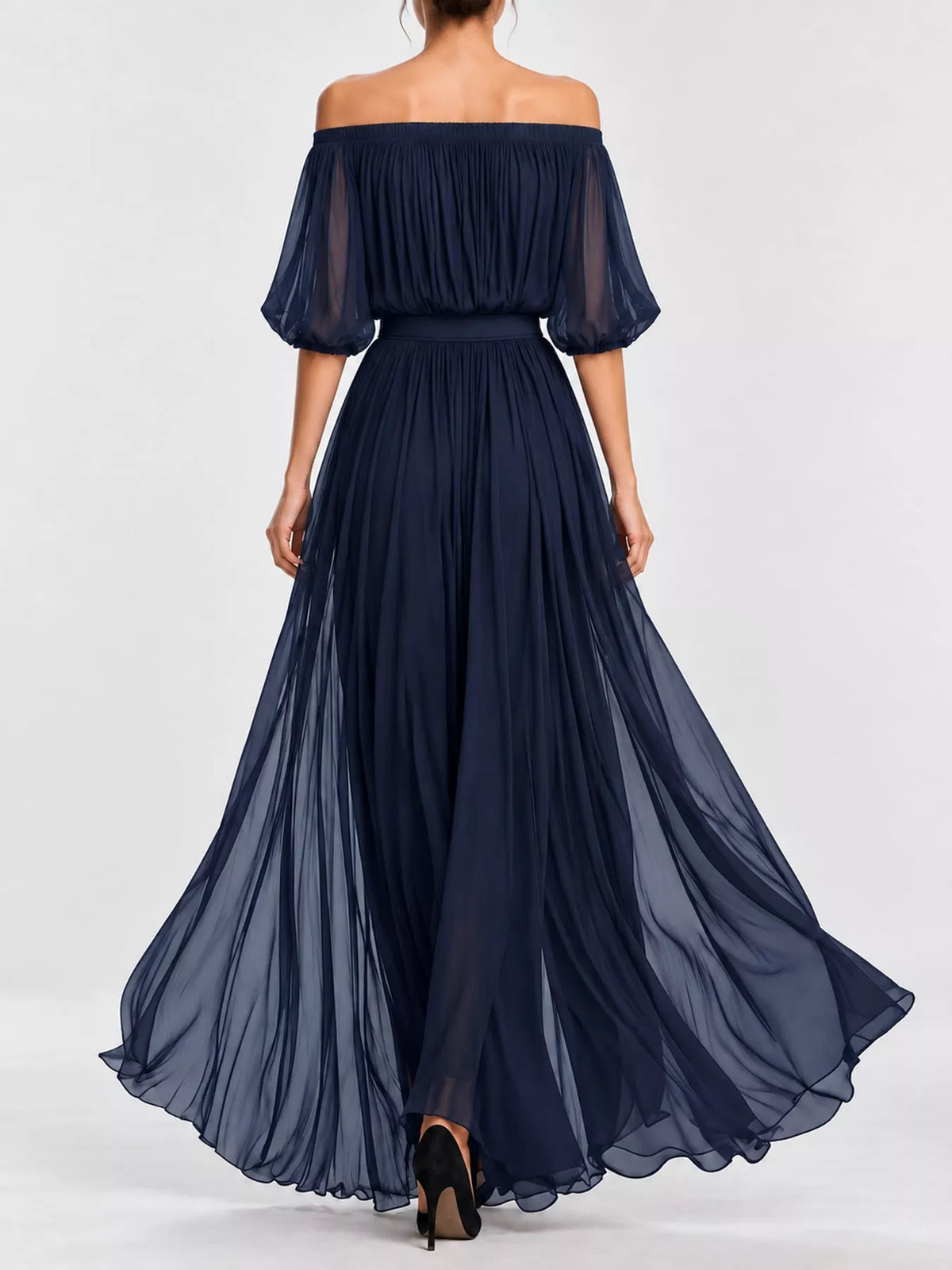 Navy off-shoulder chiffon maxi dress from back view with ruched waist and flowing skirt