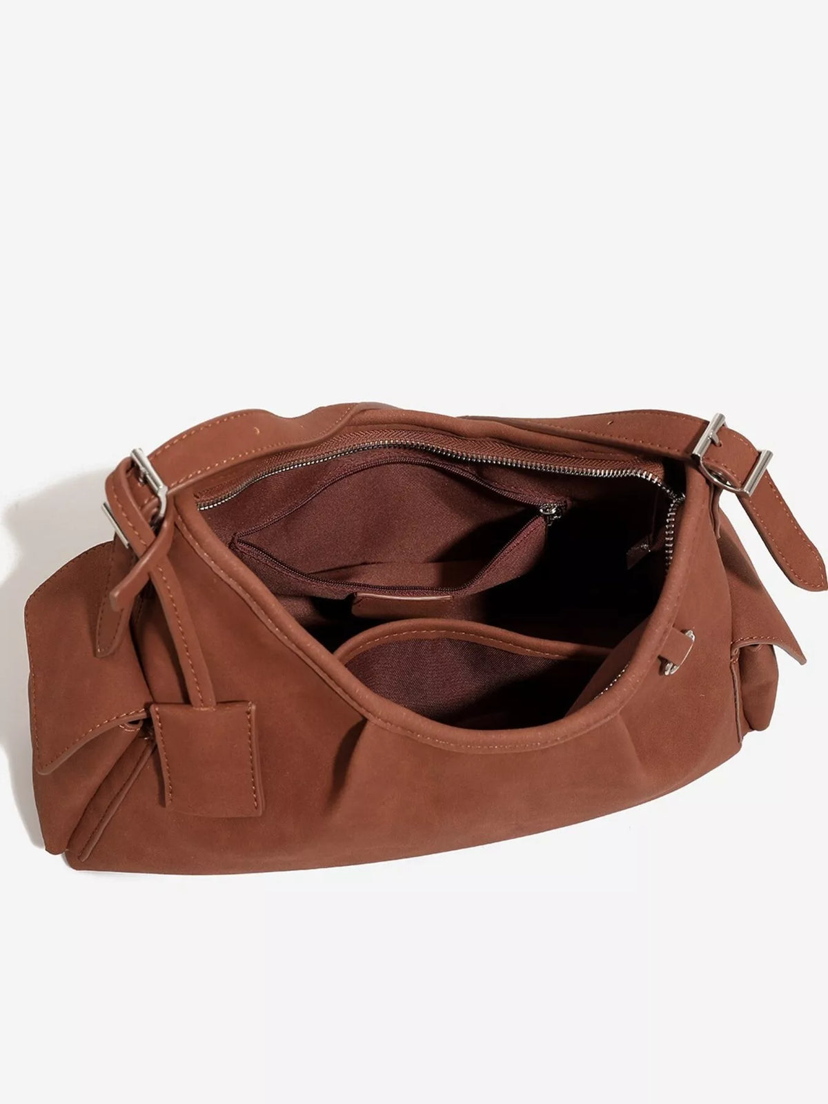 Brown suede shoulder bag interior view with zipper, inner pockets, and adjustable strap