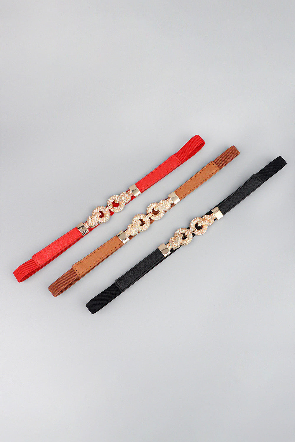 Red vegan leather belt with zinc alloy buckle and oval chain link ornament