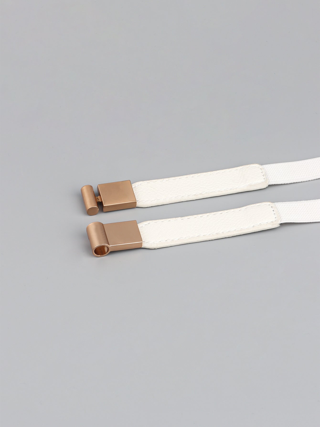 Elastic vegan leather skinny belt, white with rose-gold buckle ends