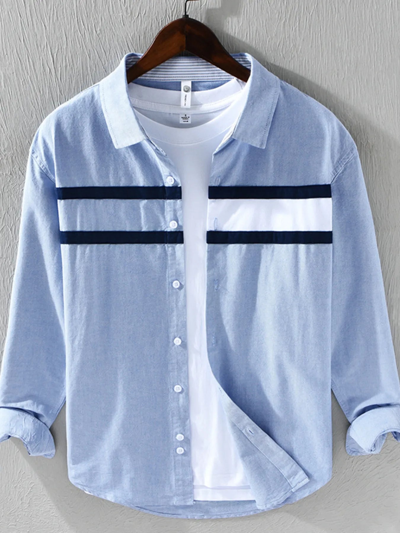 Light blue striped button-down shirt with navy horizontal bands and button front