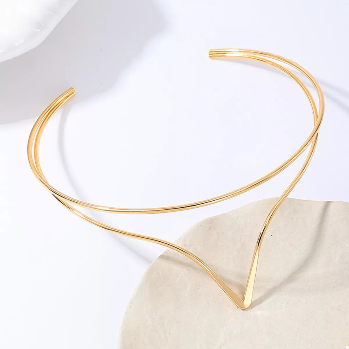 Gold double-layer V-shaped choker necklace with two stacked thin loops and V tip