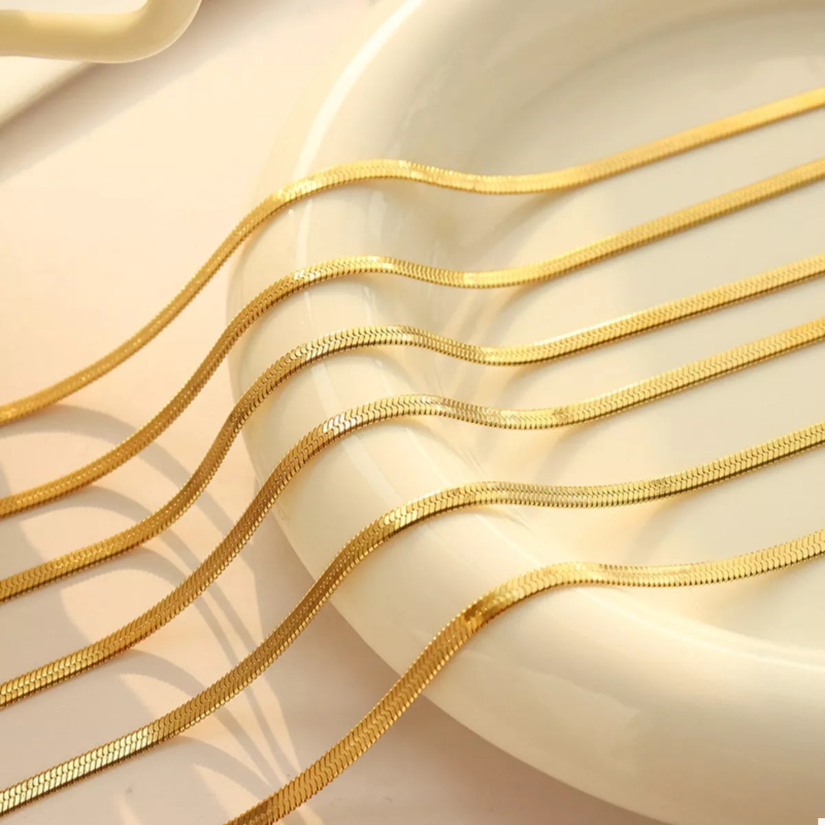 Layered gold-plated chain necklace with several slim strands