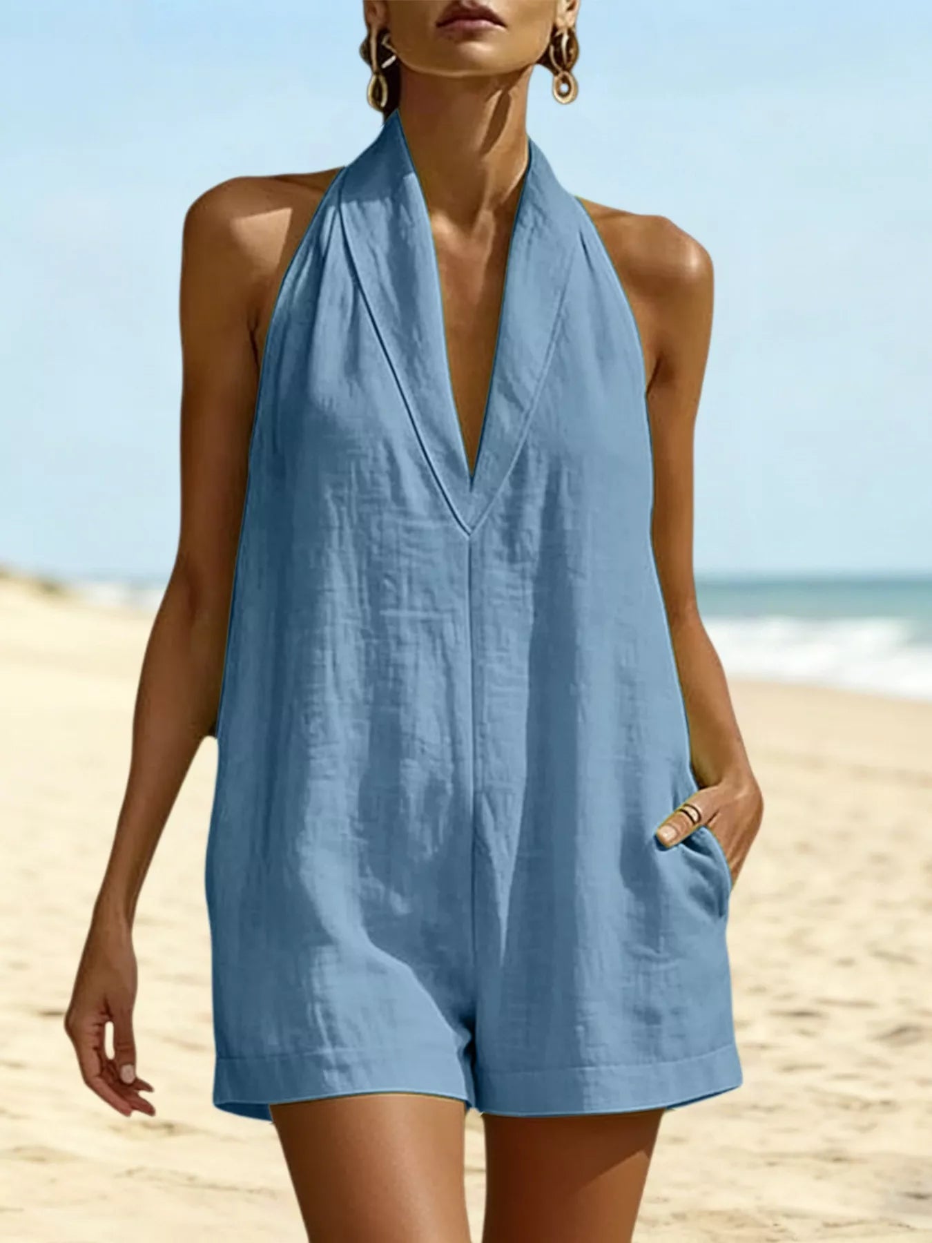 Blue halter neck romper with pockets, sleeveless front