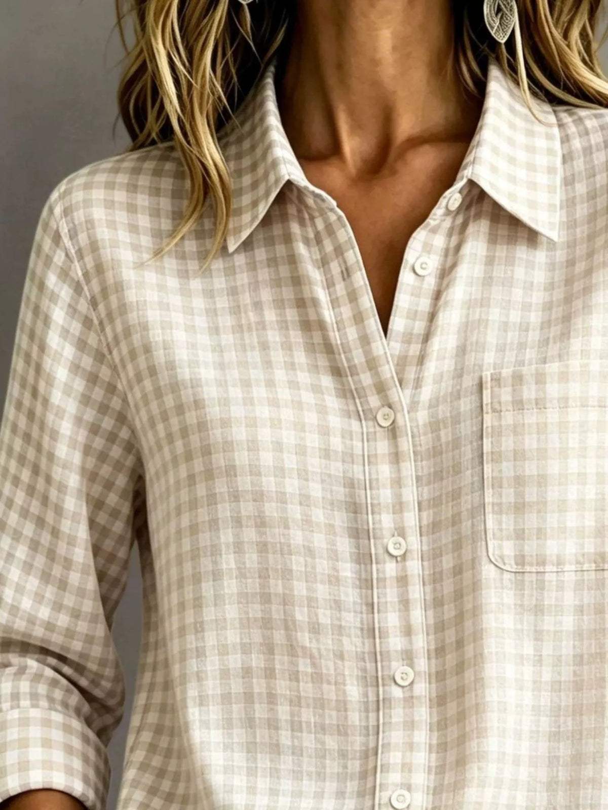 Beige gingham button-down shirt close-up with button placket and chest pocket