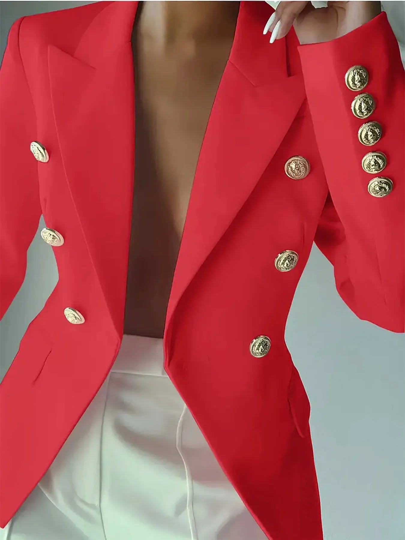 Red blazer with notch lapel, gold decorative buttons, and long sleeves