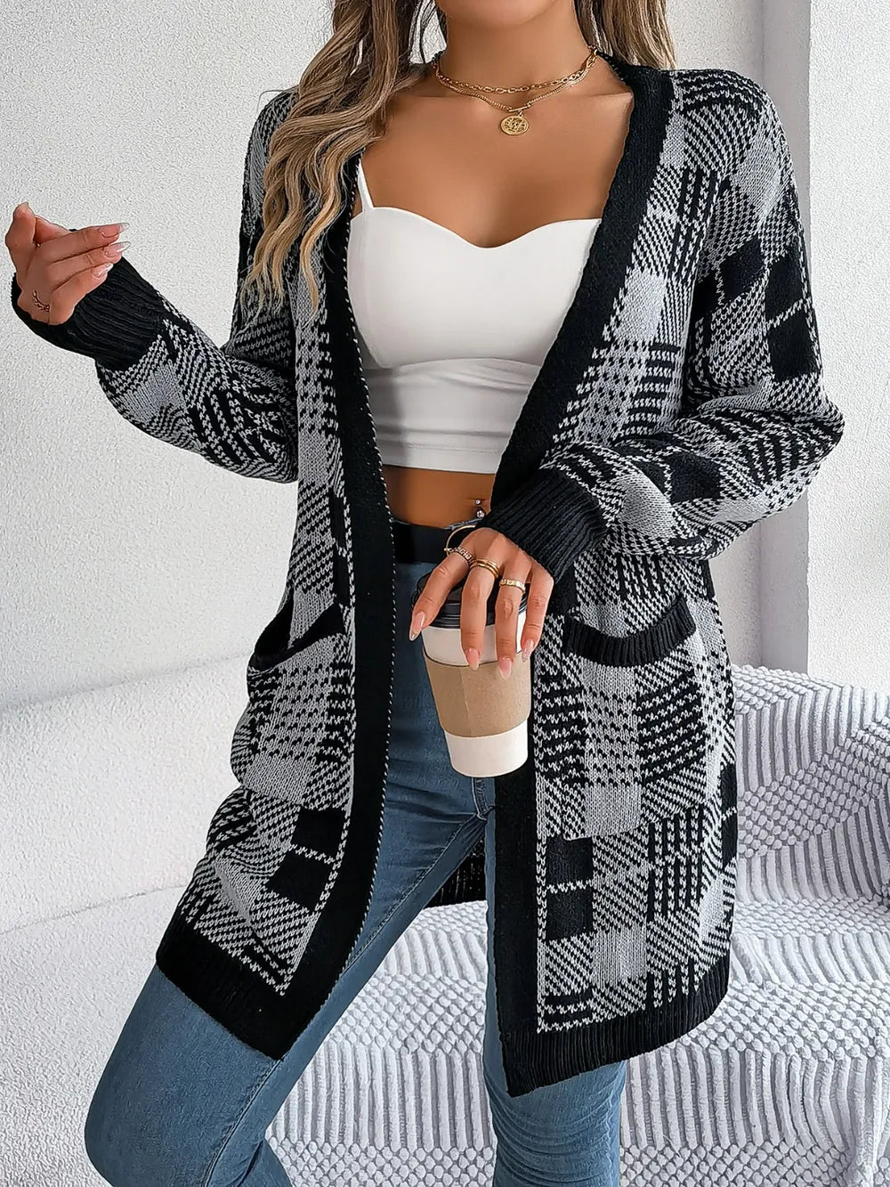 Plaid open-front long sleeve cardigan in black and white, with ribbed cuffs and hem