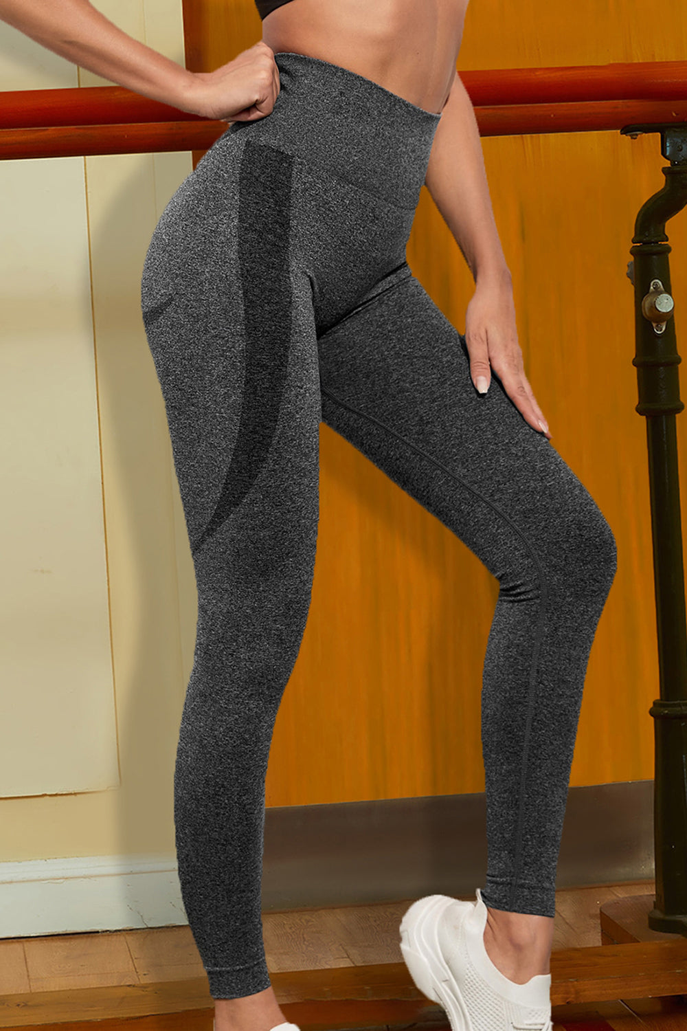 Charcoal sports leggings, wide waistband, angled side view, textured fabric
