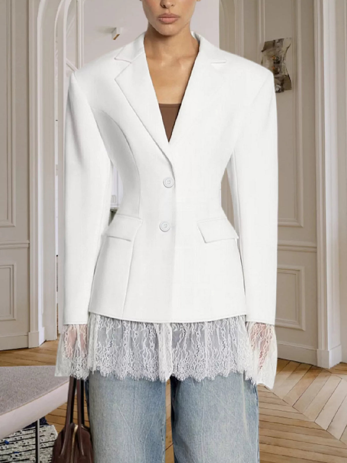 Women's white blazer front with button closure and lace-trim hem