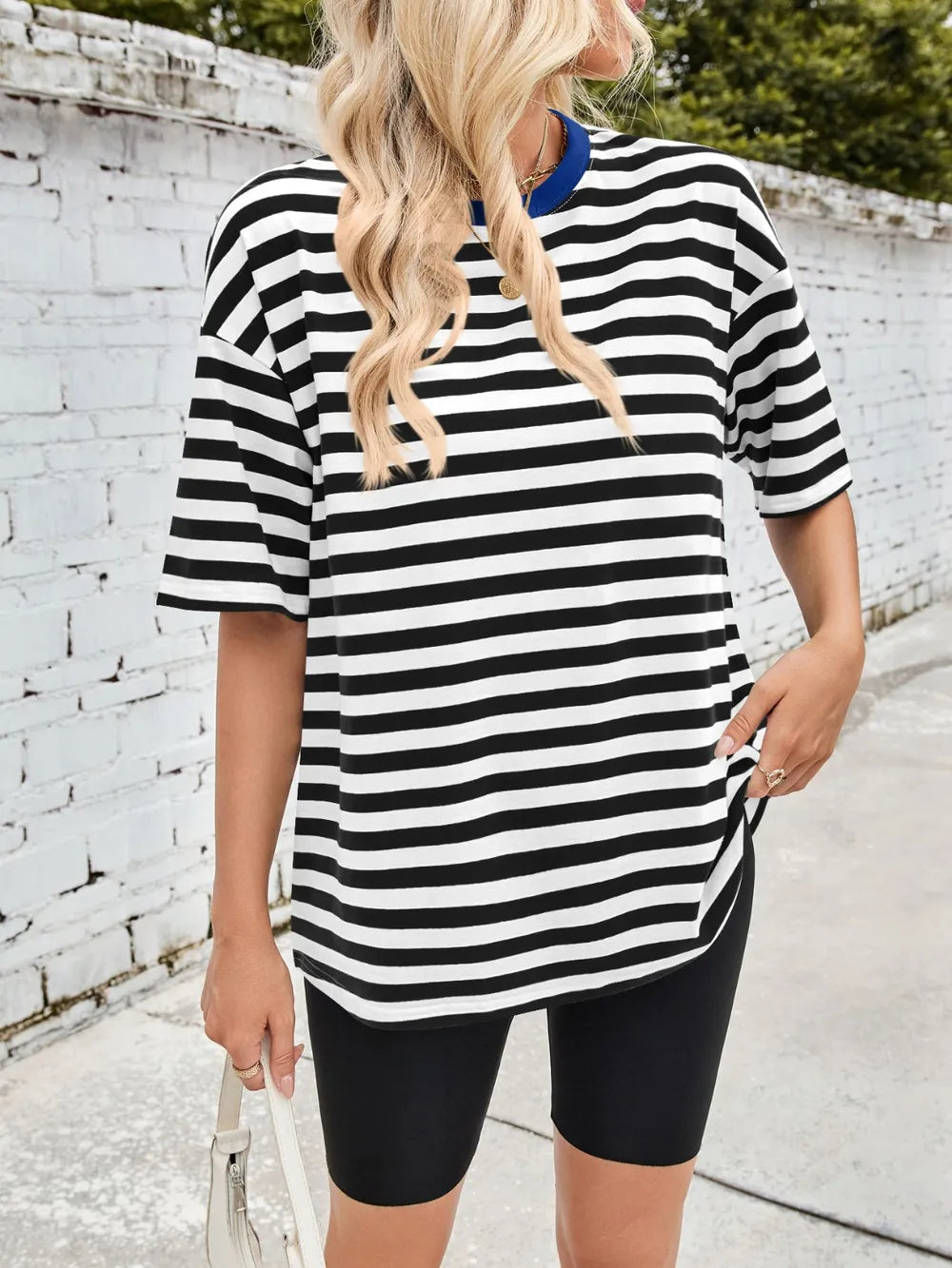 Black striped round-neck half-sleeve T-shirt with relaxed fit, front view.
