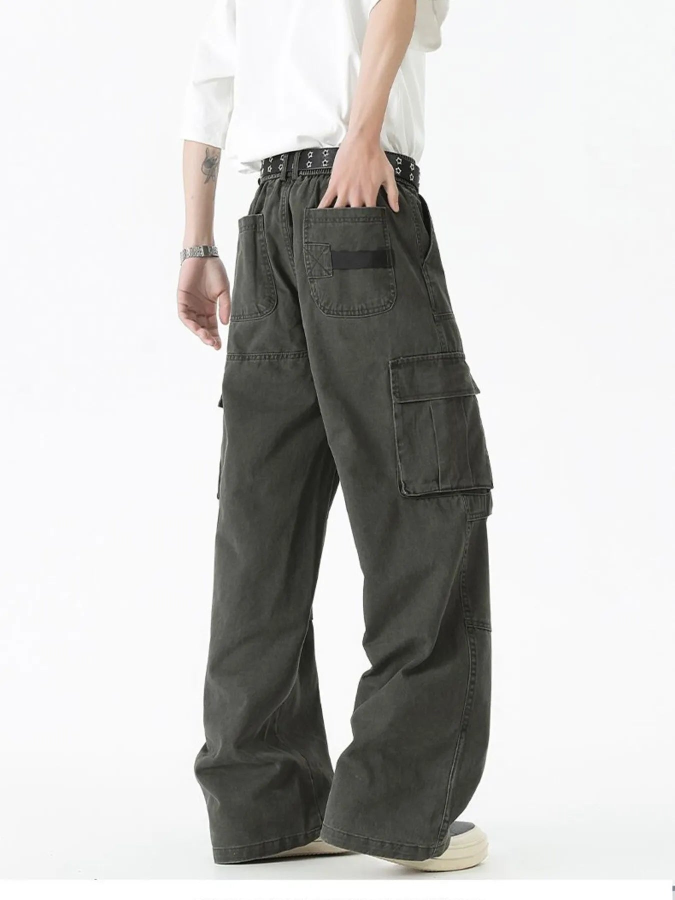 Dark green wide-leg cargo pants with side cargo pocket and front flap details