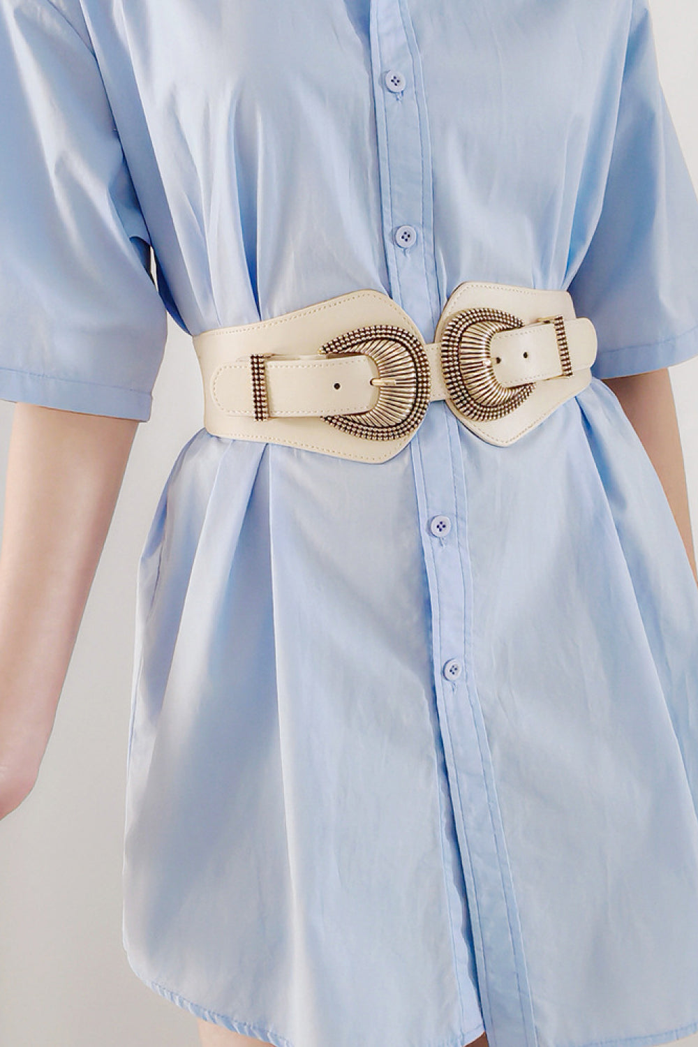 Cream elastic wide belt with double shell buckle and gold-tone ring hardware