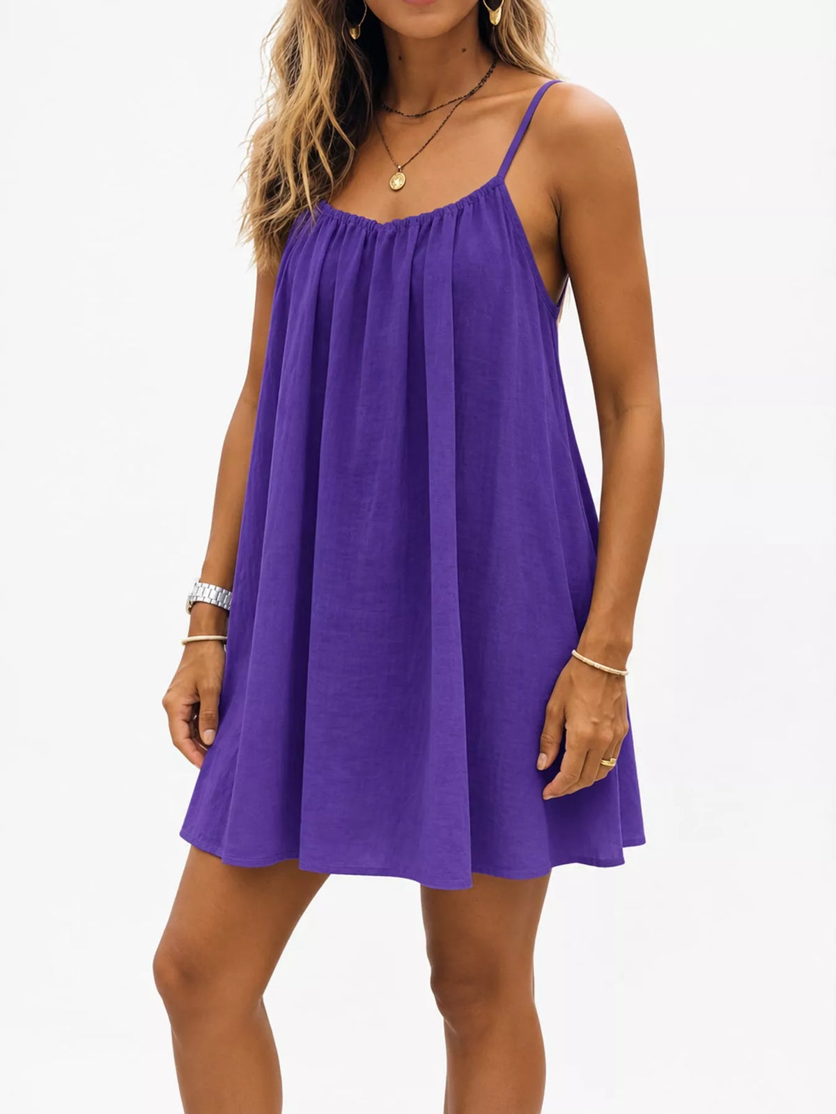 Backless spaghetti strap ruched mini dress in purple with gathered neckline and pleated skirt