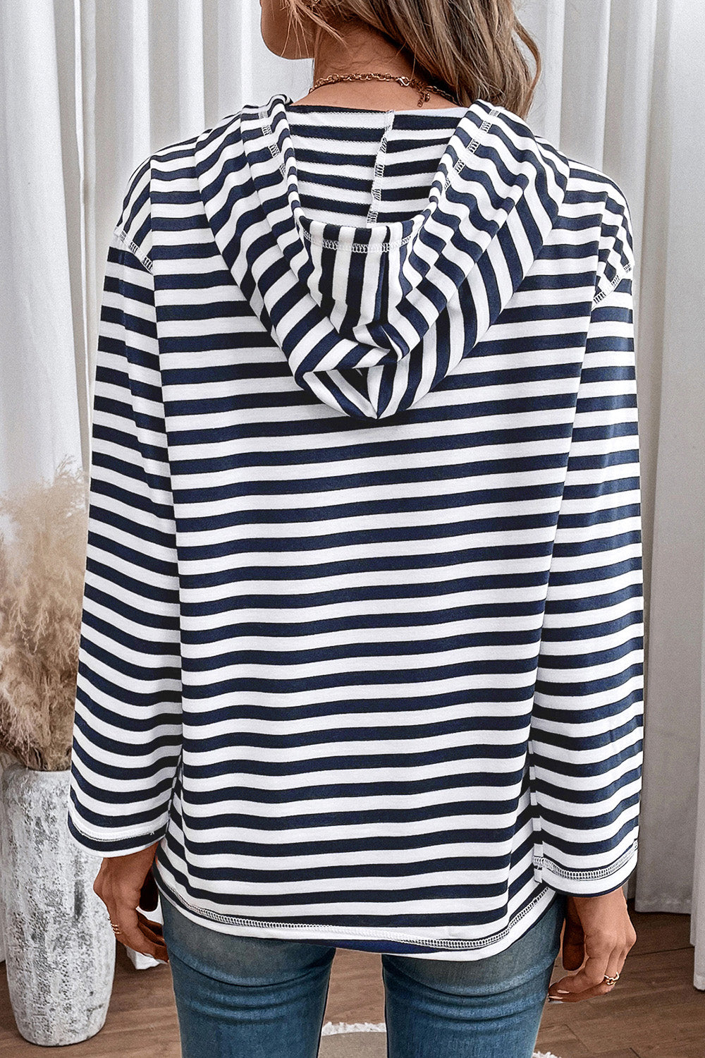 Navy-and-white striped long sleeve hoodie, back view with hood and drawstring