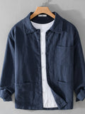 Dark blue button-up shirt with chest pocket, button front, and long sleeves.