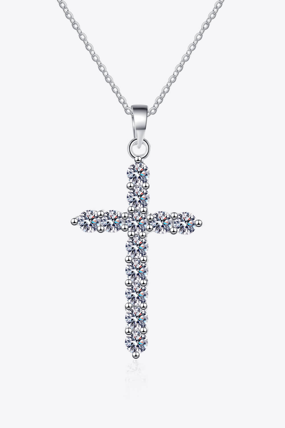 Sterling silver cross pendant necklace with pavé moissanite stones, front view