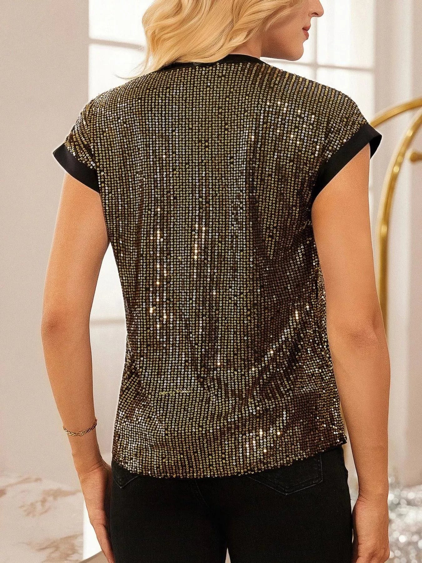 Sequin Notched Cap Sleeve Blouse by Trendsi, black with gold sequins and black sleeve trim