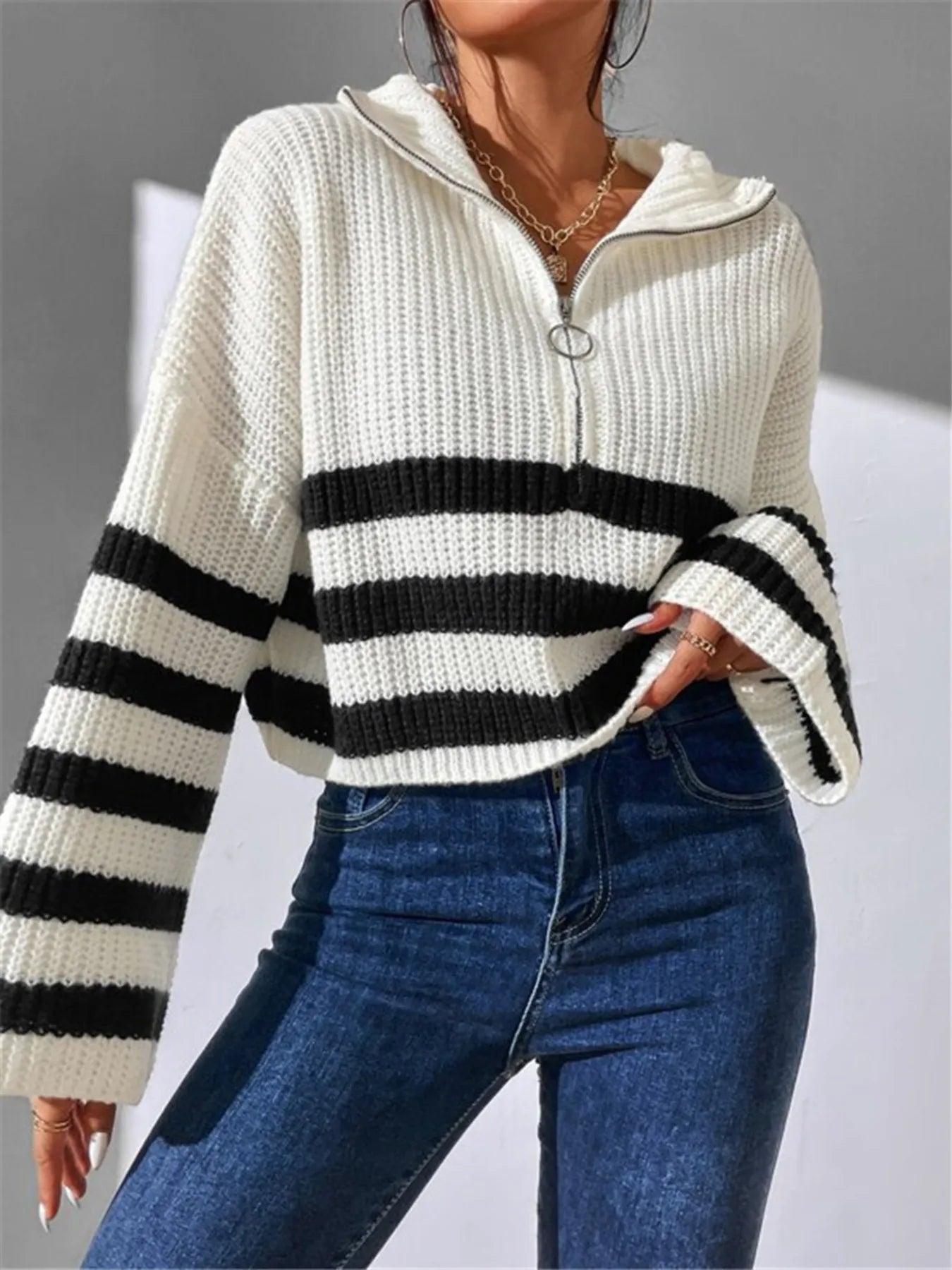 White ribbed cropped half-zip sweater with black-and-white striped horizontal bands
