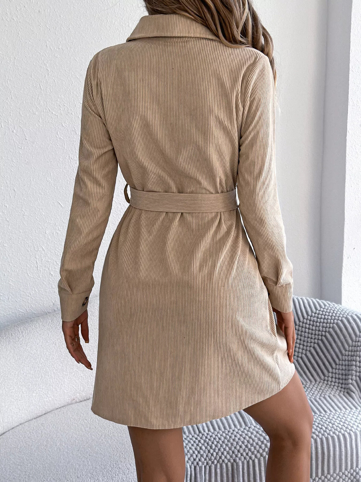 Khaki corduroy shirt dress back view with tied waist belt and long sleeves