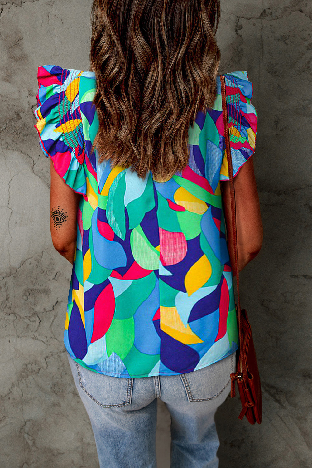 Printed round-neck butterfly-sleeve top with colorful abstract leaf pattern, back