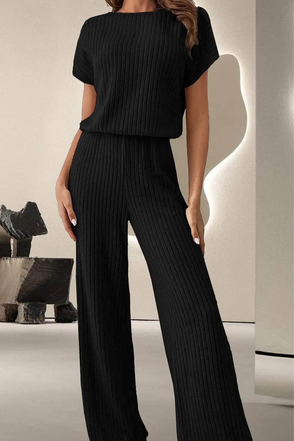 Black ribbed knit round-neck short-sleeve jumpsuit with wide legs