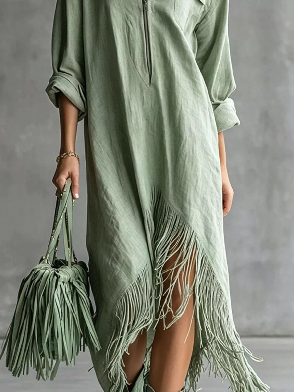 Sage green midi dress with fringe hem and side slit detail