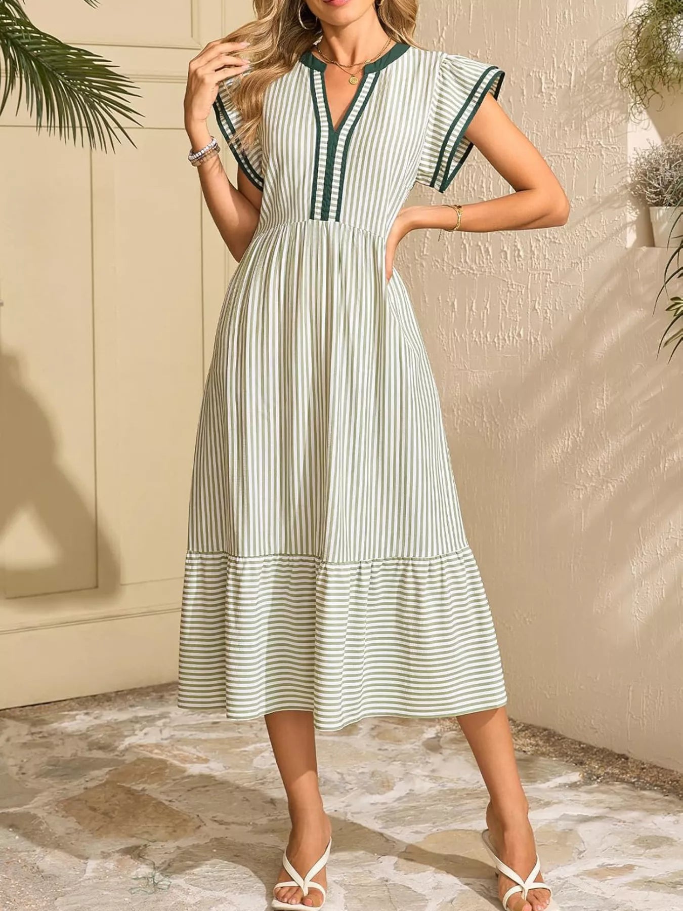 Green-and-cream striped midi dress with ruffle cap sleeves and gathered waist