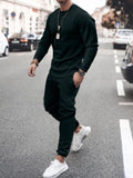 Men's black long sleeve lounge set with round neck top and tapered jogger pants