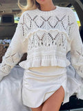 White crochet long sleeve sweater with ruffled waist peplum and open knit lace pattern