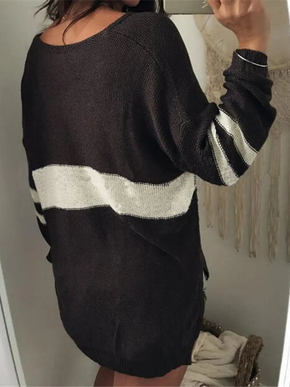 Black V-neck long-sleeve sweater with cream-and-dark horizontal stripe bands