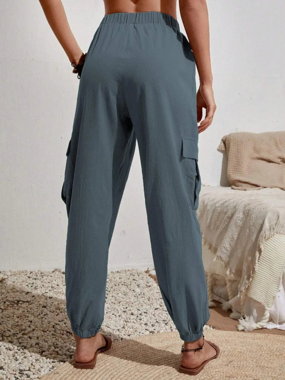 Drawstring joggers in slate blue, cargo pockets, drawstring waist, elastic cuffs