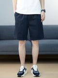 Relaxed-fit men's casual pocketed shorts, navy blue, knee-length