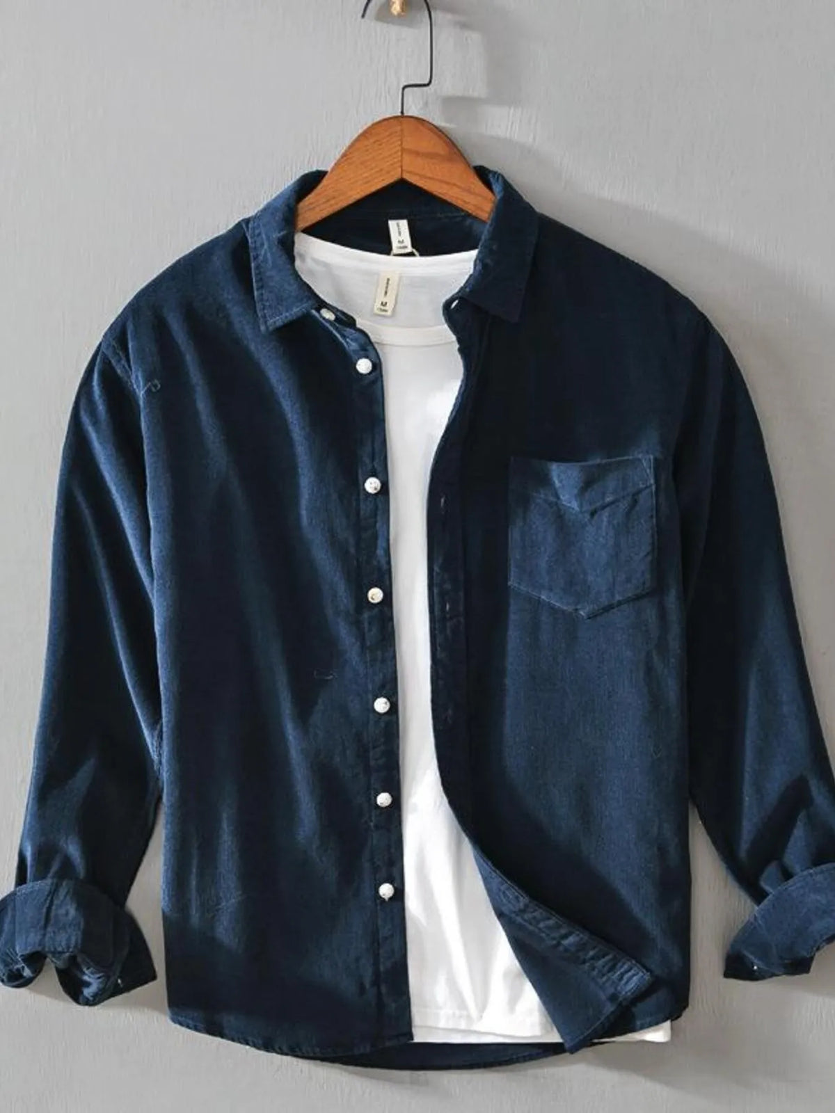 Men's navy cotton button-up shirt with long sleeves, button front, and chest pocket