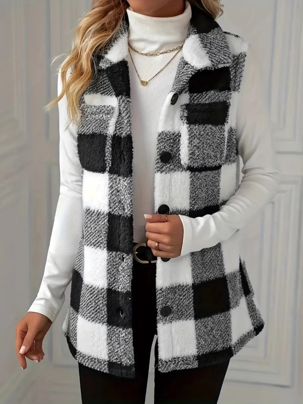 Black-and-white plaid sherpa vest coat with button front and chest flap pockets