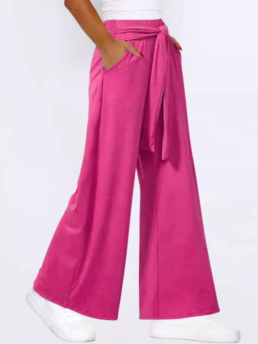Hot pink wide-leg pants with waist tie and visible side pockets