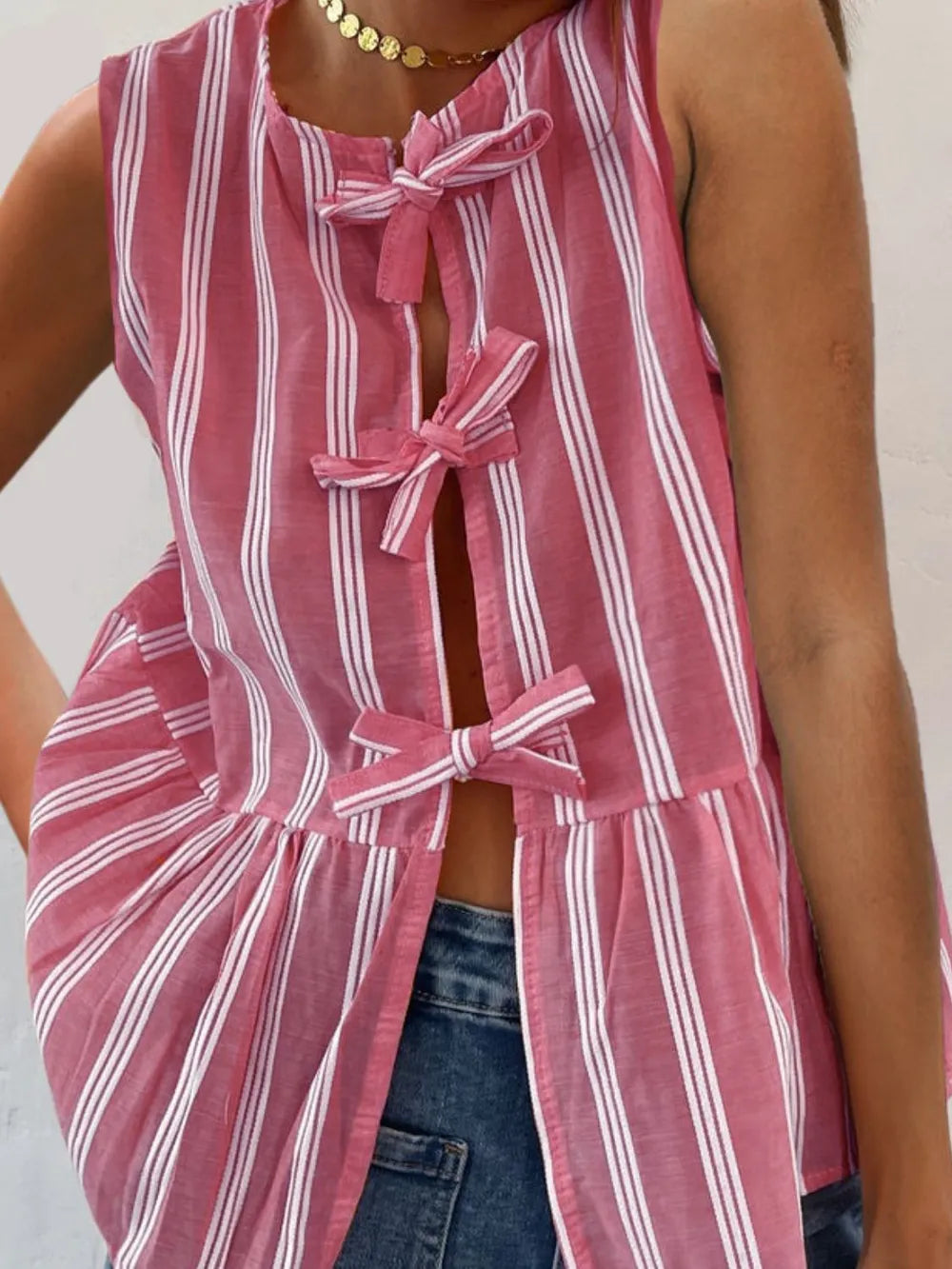 Striped round-neck tank top, pink with white vertical stripes, bow ties at neckline