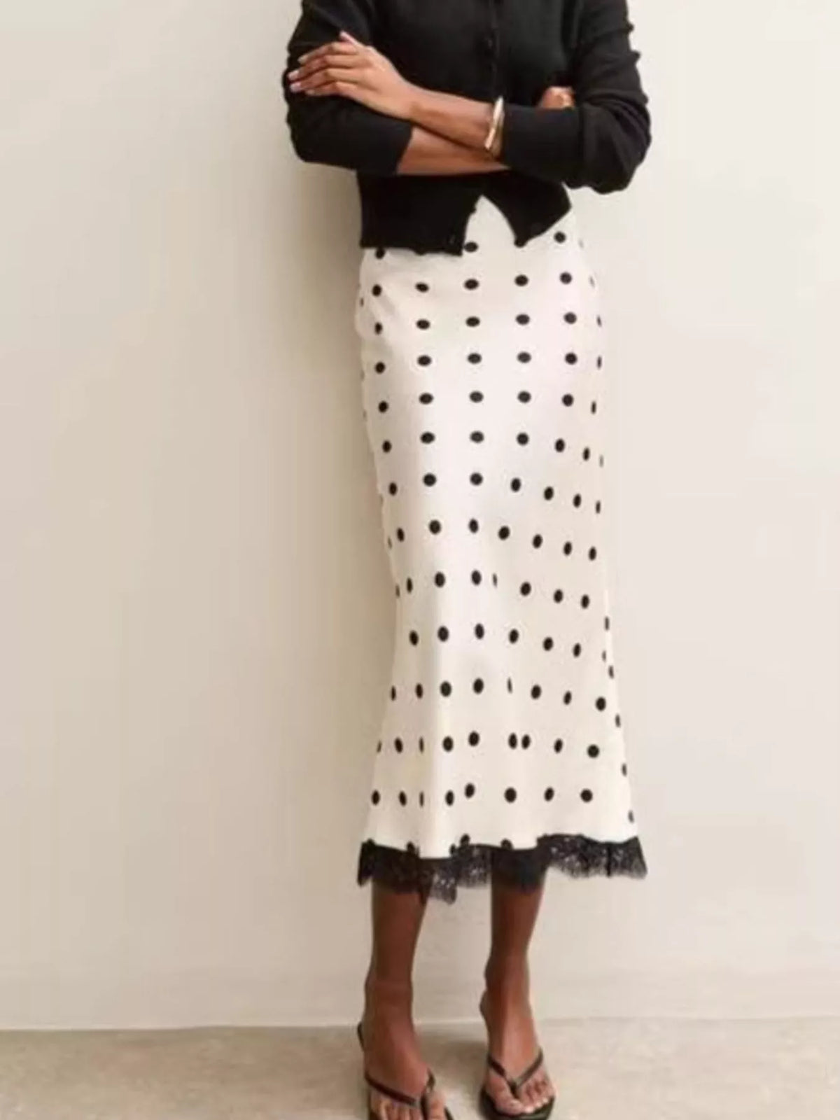 White midi skirt with black polka dots and scalloped lace edge hem