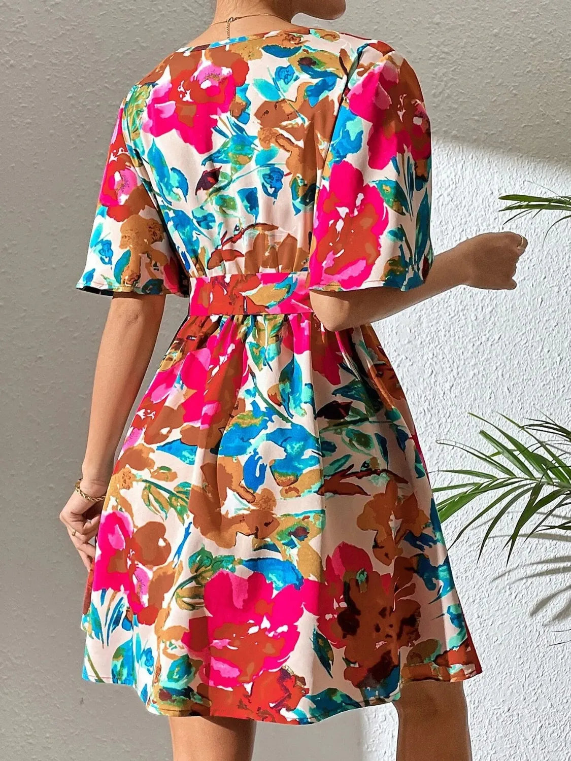 Printed Surplice Short Sleeve Multicolor Floral Mini Dress with belted waist.