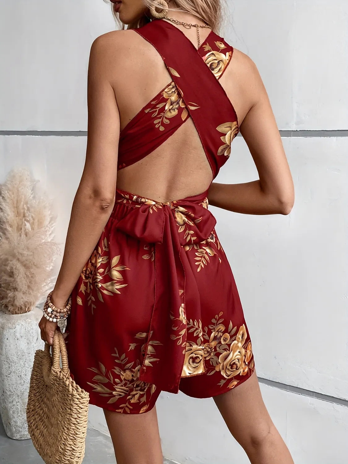 Burgundy floral printed romper with crisscross open back and tie waist