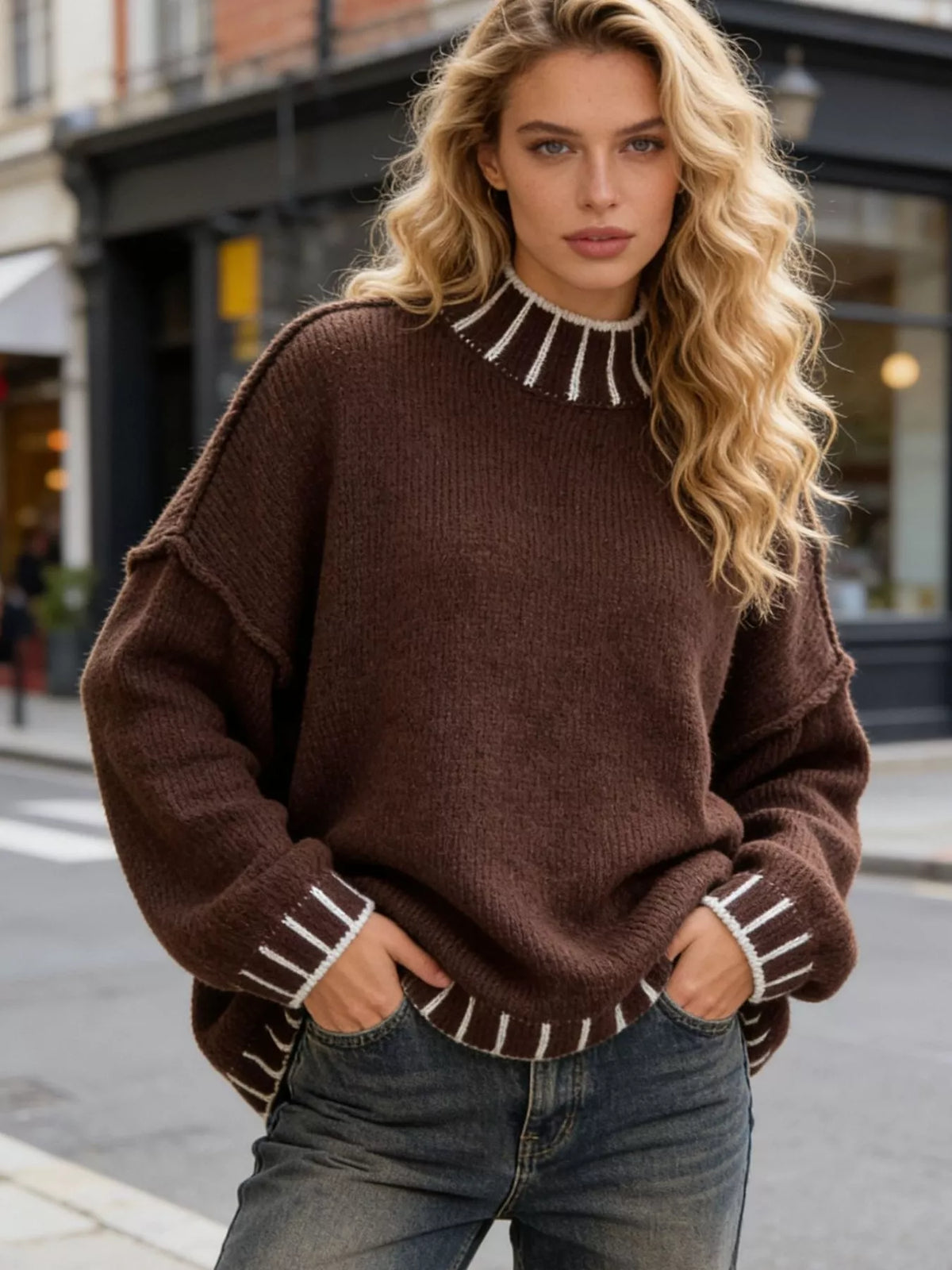 Brown knit turtleneck sweater with striped ribbed cuffs and dropped shoulders