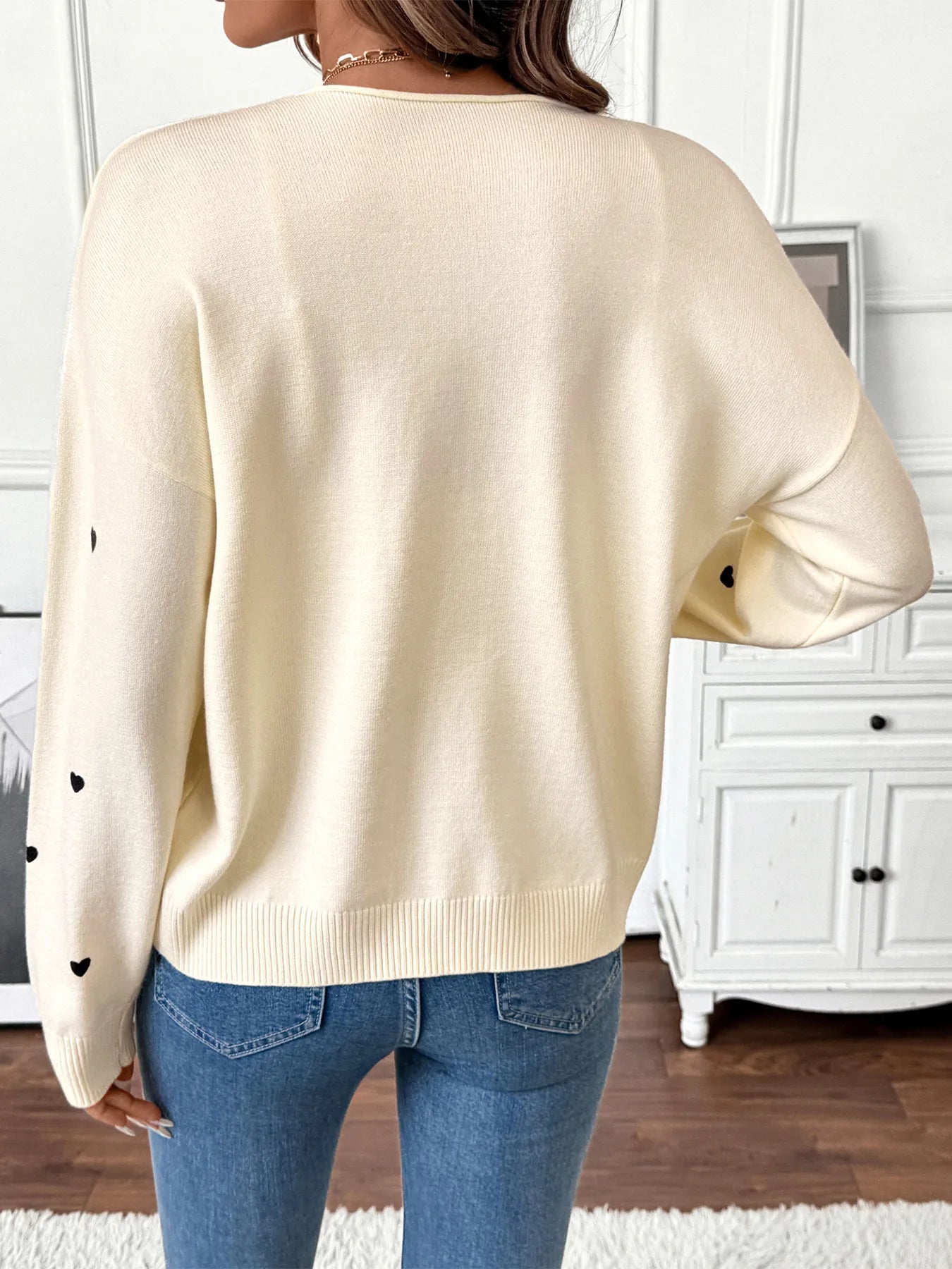 Cream heart tie-front long sleeve cardigan, back view with ribbed cuffs and hem