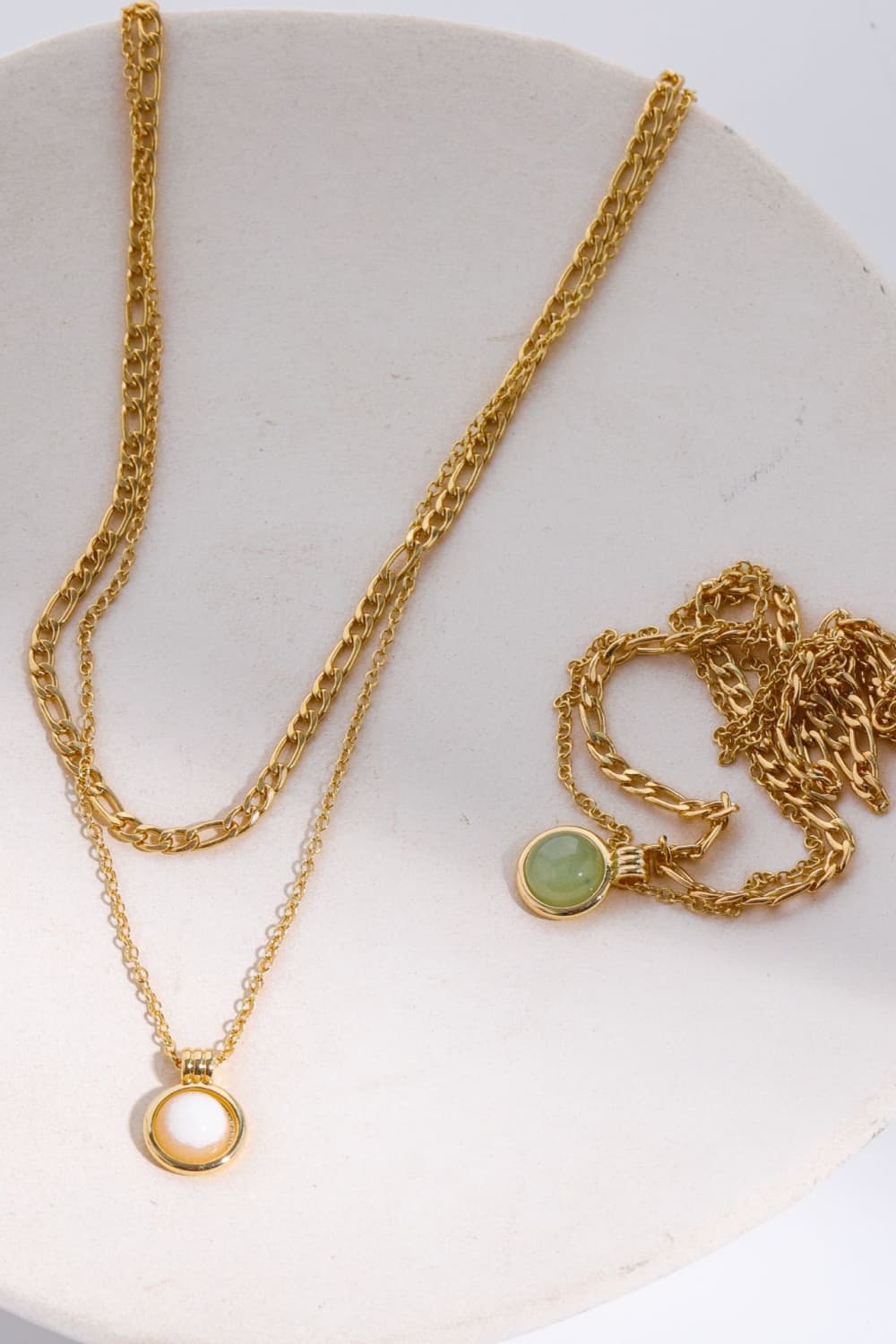 Gold-plated pendant necklace with round green and white charms and chain links