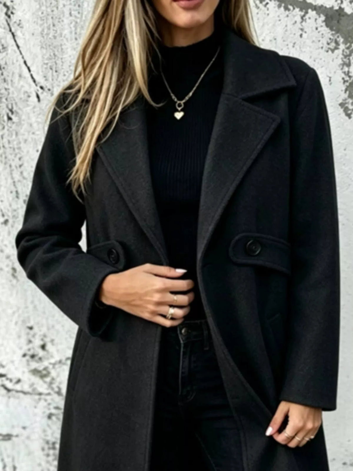 Dark charcoal longline button-lapel coat with flap pockets and front buttons