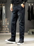 Men's slim-fit washed jeans with panel seams, dark color, five-pocket design