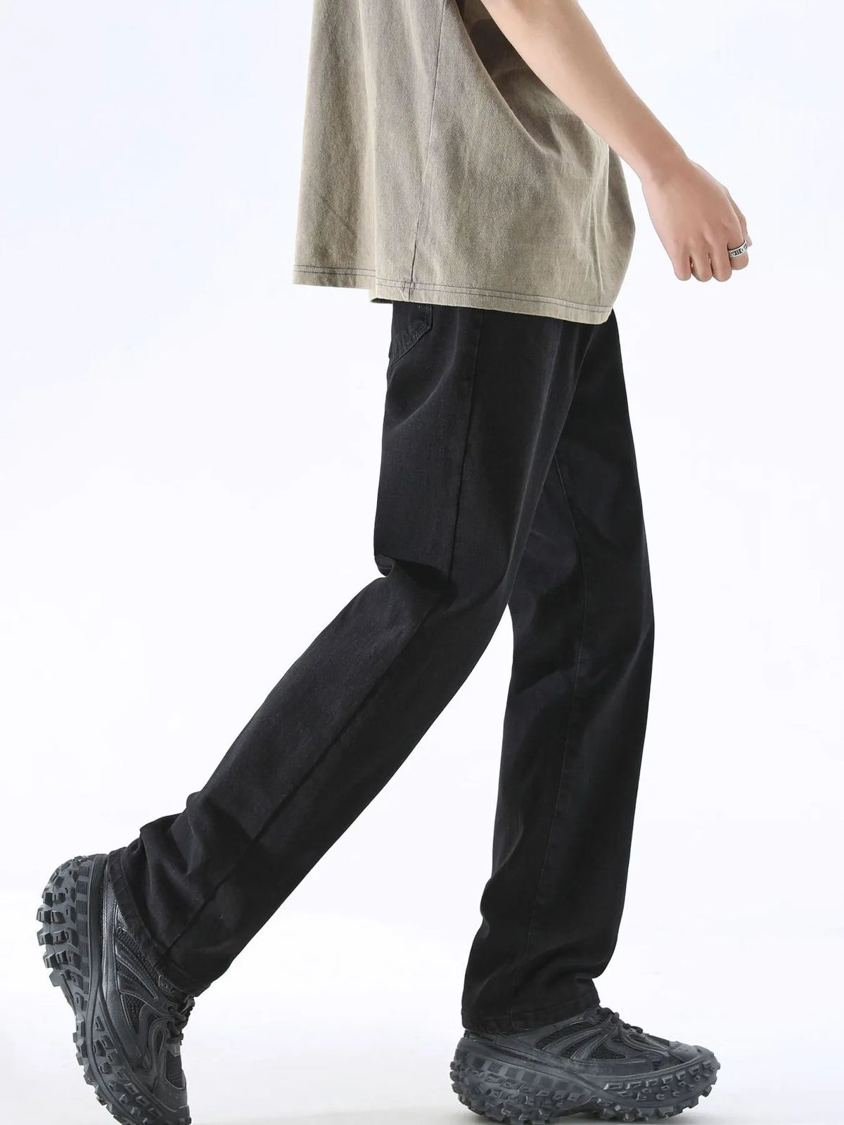 Black washed wide-leg jeans with relaxed straight legs and sturdy belt loops, side view.