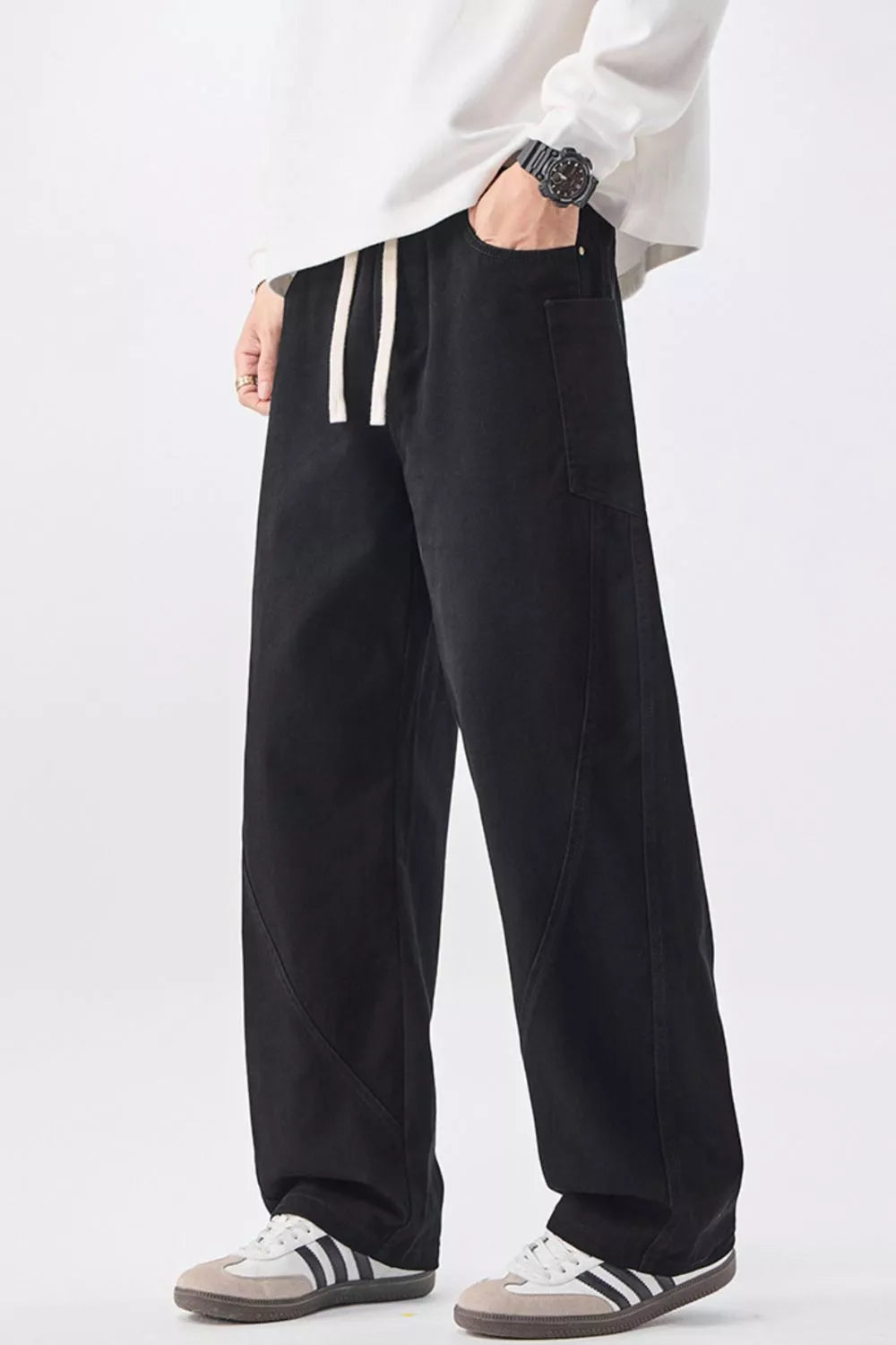 Men's black cotton drawstring waist jeans with relaxed straight-leg fit