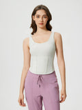 White round-neck active tank with wide straps and stitched bust seams