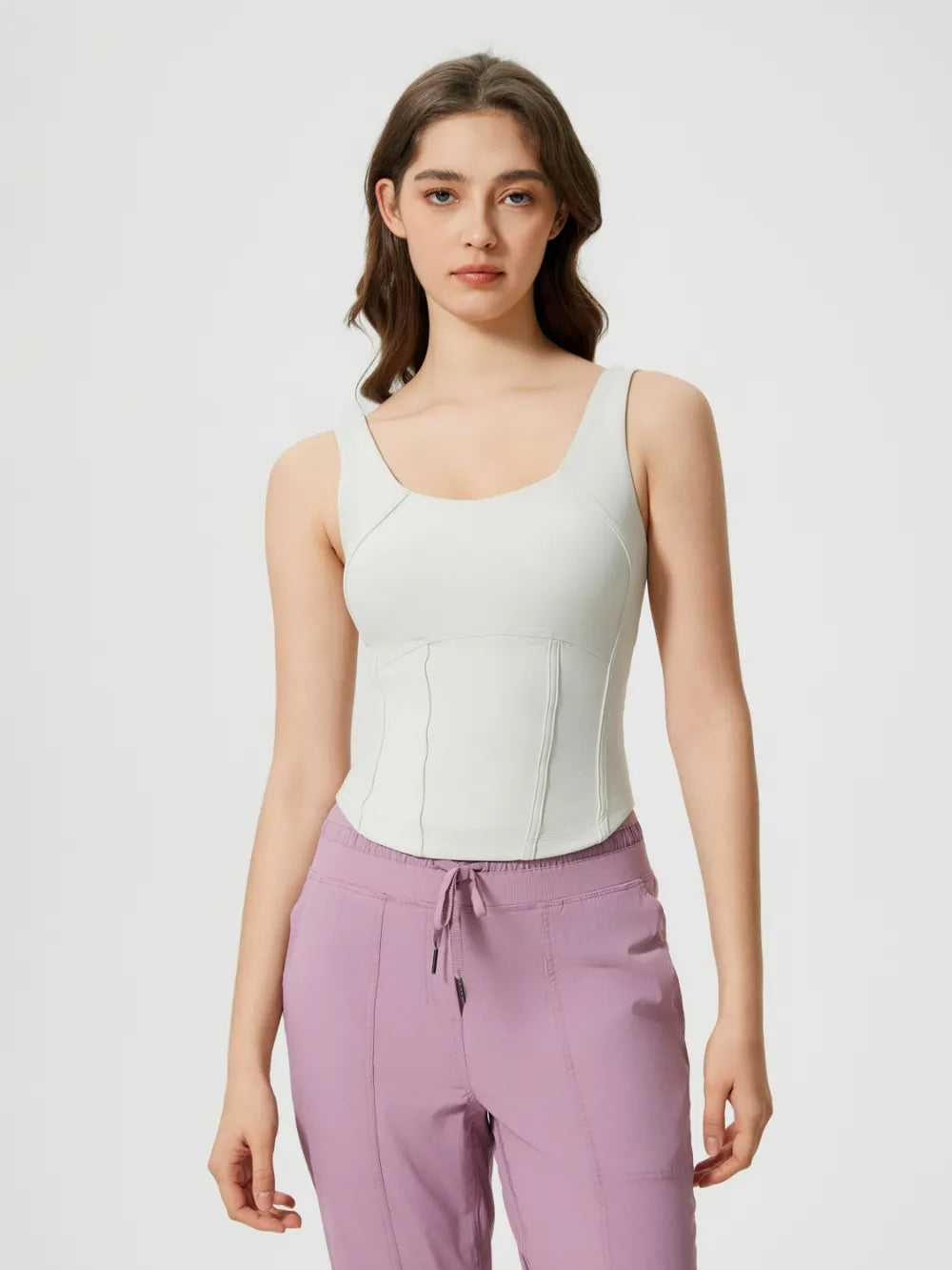 White round-neck active tank with wide straps and stitched bust seams