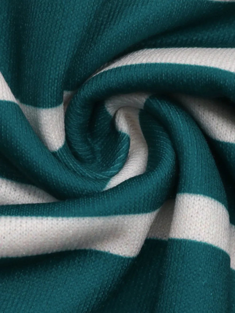 Close-up of turquoise and white striped sweatshirt fabric with knit texture