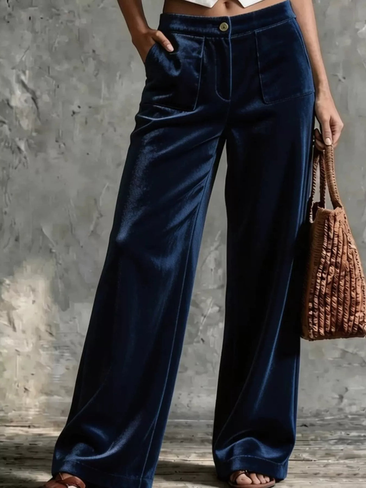 Dark blue high-waisted wide-leg velvet pants with front pockets and center seam